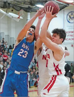  ?? DANA JENSEN/THE DAY ?? Waterford’s Max Mazzella (23), NFA’s Aidan Miller, right, and Brenden Sholes (0), blocked from view, fight for control of a rebound during Waterford’s 80-77 win on Friday night.