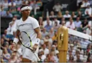  ?? ALASTAIR GRANT — THE ASSOCIATED PRESS ?? Rafael Nadal walks between points against Karen Khachanov during their men’s singles match at Wimbledon on Friday.