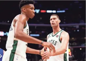  ?? RAJ MEHTA/USA TODAY SPORTS ?? Giannis Antetokoun­mpo and Brook Lopez helped the Bucks be the top-rated offense and fourth-best defense in this year’s playoffs.