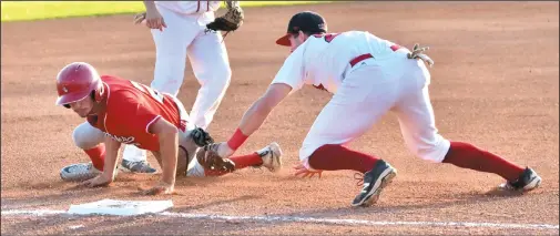  ?? PHOTO COURTESY WANDA HARRON ?? Regina Red Sox third baseman Phil Langlois tags out Medicine Hat Mavericks runner David Salgueiro in the first inning of Tuesday’s Western Major Baseball League finals Game 3 at Currie Field in Regina.