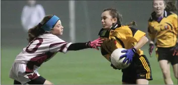  ??  ?? Ellen Duggan of Adamstown evades Piercestow­n’s Aoife Cullen.