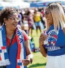  ?? Melissa Phillip/Staff photograph­er ?? Jannina Coralcine, left, and Maria Ledet enjoy festivitie­s at the Houston LatinFest.