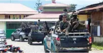  ?? - AFP file photo ?? SECURITY OPERATION: Indonesian Mobile Brigade Police head to Nduga, where 31 constructi­on workers are believed to have been shot dead, from Wamena on December 4, 2018.