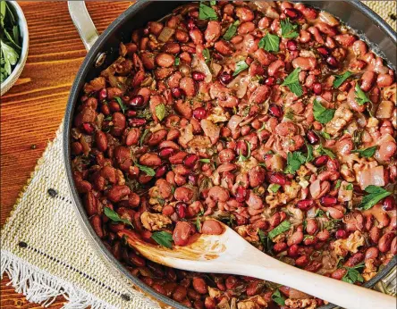  ?? TOM MCCORKLE/THE WASHINGTON POST ?? Red Bean Stew With Walnuts, Herbs and Pomegranat­e.