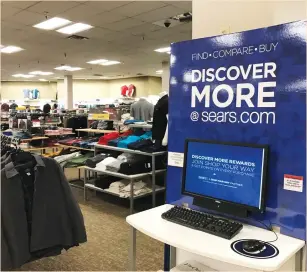  ?? (Mike Blake/Reuters) ?? AN ONLINE SHOPPING kiosk is seen inside a Sears department store in La Jolla, California.