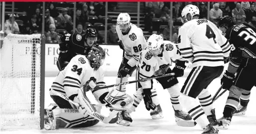  ?? JAE C. HONG/AP ?? Blackhawks goaltender Petr Mrazek makes a save in the first period Monday night against the Ducks. He allowed two goals in the period.