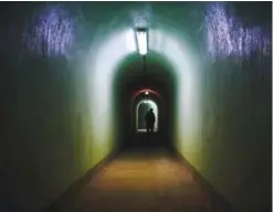  ??  ?? KOCEVJE: A man walks inside of the Skrilje bunker located in a forest 90 meters bellow the ground on a sealed-off military base near town of Kocevje, Slovenia. — AFP