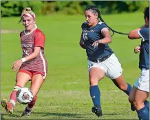  ?? SARAH GORDON/THE DAY ?? Lindsey Fairbank of Mitchell College, left, takes a shot as Jillian DeLorey of Fisher College defends during a women’s soccer game on Wednesday at New London. Mitchell won 1-0.