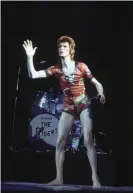  ??  ?? David Bowie performing as Ziggy Stardust, in his ‘woodland creatures’ costume designed by Yamamoto, in 1973. Photograph: Debi Doss/Getty Images