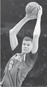  ?? STEVE DYKES, USA TODAY SPORTS ?? Kristaps Porzingis, who averaged 18.1 points last season, says he’s committed to the Knicks.