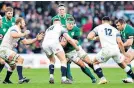  ??  ?? Too high: Owen Farrell makes a typical ‘soak-up’ tackle on Ireland’s CJ Stander