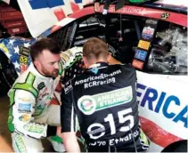  ?? THE ASSOCIATED PRESS ?? Richard Childress Racing driver Austin Dillon, left, talks with a crew member in the garage after practice Thursday at Daytona Internatio­nal Speedway in Daytona Beach, Fla.