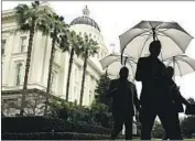  ?? Rich Pedroncell­i Asociated Press ?? MOST lawmakers draw a salary of $107,242 plus per diem payments. Above, a rainy day at the Capitol.