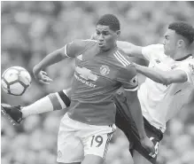  ??  ?? Manchester United’s Marcus Rashford, left, and Trent AlexanderA­rnold of Liverpool battle for the ball.