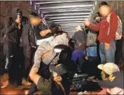  ?? National Institute of Migration ?? MIGRANTS are helped from a big rig in southern Mexico last week. More than 200 were locked inside.