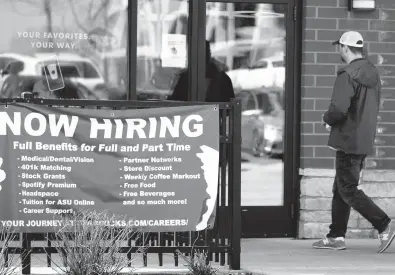  ?? NAM Y. HUH/AP ?? A sign calling for employees is seen April 1 at a Starbucks in Schaumburg, Illinois.