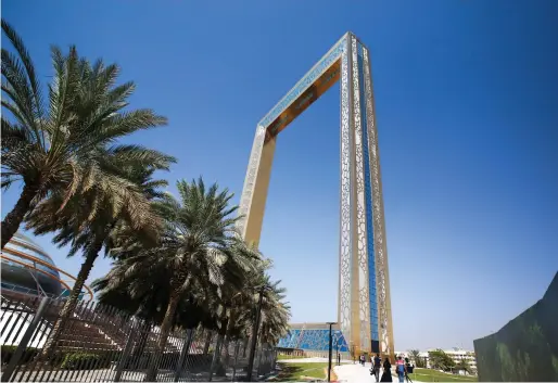  ?? Victor Besa for The National ?? Dubai Frame, left, offers visitors a view of the city from all angles but the glass floor inside the structure, bottom left, might be a bit of a challenge for those not blessed with a head for heights