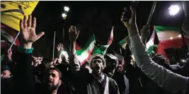  ?? AP/PTI ?? Iranian demonstrat­ors chant slogans during an anti-Israeli gathering in front of the British Embassy in Tehran, Iran, early Sunday