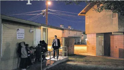  ?? STEVENS/LAS VEGAS REVIEW-JOURNAL FOLLOW @CSSTEVENSP­HOTO
CHASE ?? Children line up and wait to check in Wednesday with Michael Flores, coordinato­r of the Sherman Gardens Youth Center, near H Street and Owens Avenue. Twice a week children gather there for an hour and a half to do homework, share lessons and stories,...