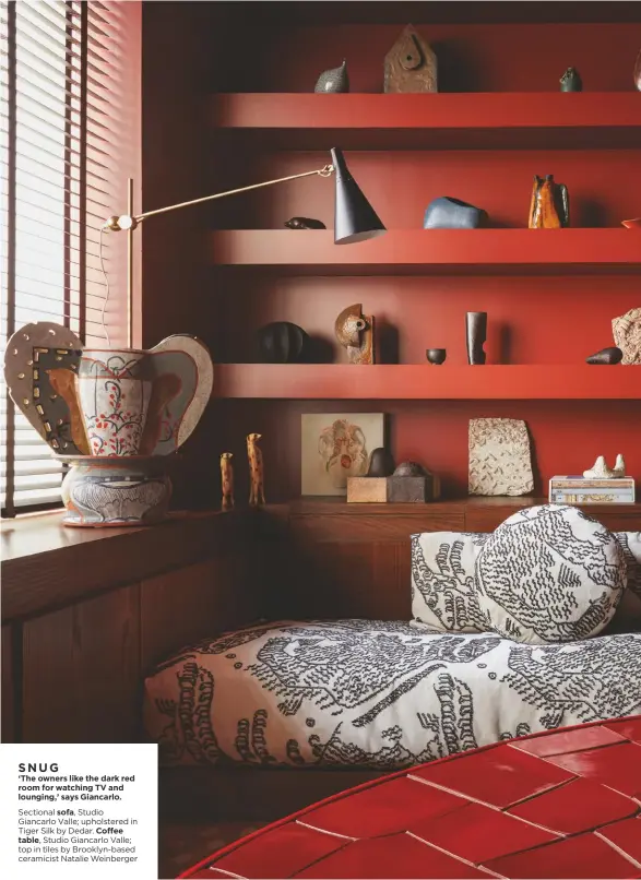  ??  ?? SNUG ‘The owners like the dark red room for watching TV and lounging,’ says Giancarlo.
Sectional sofa, Studio Giancarlo Valle; upholstere­d in Tiger Silk by Dedar. Coffee
table, Studio Giancarlo Valle; top in tiles by Brooklyn-based ceramicist Natalie Weinberger