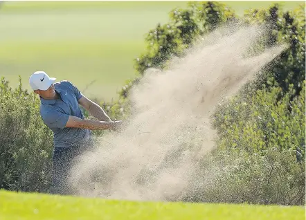  ?? — GETTY IMAGES ?? Sweden’s Alex Noren blasts his second shot from the bunker on the 14th hole Saturday on his way to a one-shot lead heading into the final round of the Farmers Insurance Open in San Diego.