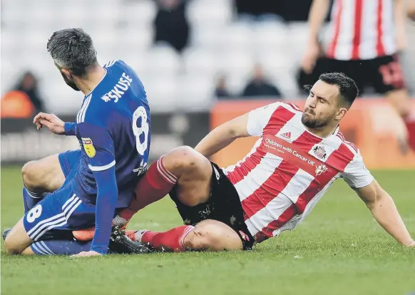  ?? Picture: Frank Reid ?? Bailey Wright makes a challenge in the 1-0 win over Ipswich Town.