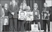  ?? Susan Walsh Associated Press ?? PRESIDENT TRUMP meets with relatives of people killed by immigrants in the U.S. illegally.