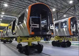  ?? CHRISTOPHE­R EVANS — BOSTON HERALD ?? Next-generation rail cars for the MBTA’s Orange Line in various states of assembly are viewed at CRRC’s massive factory in Springfiel­d. The feds are now looking into other contracts.