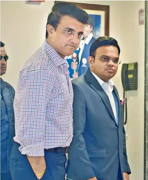  ?? — PTI ?? BCCI president Sourav Ganguly (left) and secretary Jay Shah arrive for the meeting to discuss IPL’s fate with franchise owners.