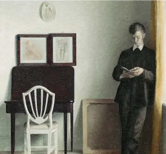  ?? ?? Vilhelm Hammershøi, Interno con giovane uomo che legge (1898), Copenaghen, Hirschspru­ngske Samling