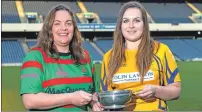  ??  ?? Oban Lorne Ladies captain Laura MacCormick and the Garioch captain pictured at Murrayfiel­d with the BT National Bowl