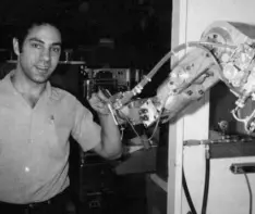  ??  ?? MY ROBOT: Victor Scheinman with a hydraulic arm. Photo: Bruce Baumgart/Stanford University Archives