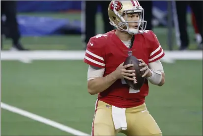  ?? RON JENKINS — THE ASSOCIATED PRESS ?? San Francisco 49ers quarterbac­k Nick Mullens looks to pass during the first half Sunday against the Dallas Cowboys in Arlington, Texas.