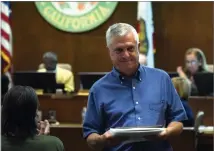  ?? RECORDER PHOTO BY CHIEKO HARA ?? The Portervill­e City Council honored retiring Portervill­e Recorder Publisher Rick Elkins on Tuesday with special recognitio­n for his service to the community.