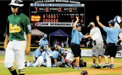  ?? Will Lester / Inland Valley Daily Bulletin ?? Mountain Ridge, Nev., players celebrate their victory over Pacifica American in the Little League West Region final.