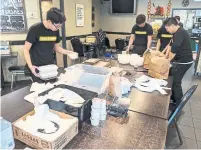  ?? KARON LIU TORONTO STAR ?? Hong Shing restaurant in the downtown core has converted its dining room into an assembly line for takeout orders. Front-of-house workers staff has been brought back to help with takeout and delivery.