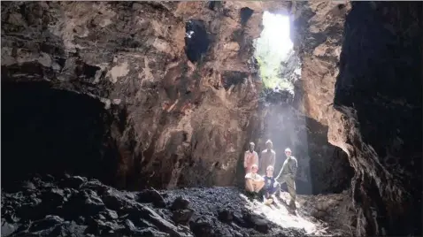  ??  ?? Explorers Mathabela Tsikoane, Maropeng Ramalepa, Dirk van Rooyen, Steven Tucker, seated left, and Rick Hunter, seated right, inside the Rising Star cave system.