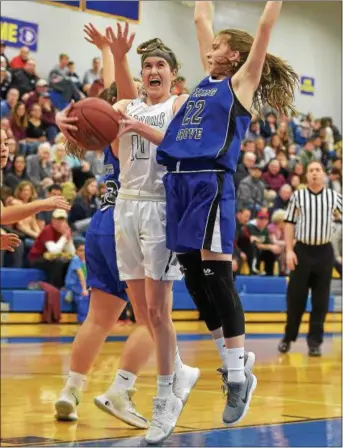  ?? PETE BANNAN — DIGITAL FIRST MEDIA ?? West Chester Henderson’s Erin Thompson lets out a scream as she shoots against Spring Grove’s Ella Kale Saturday afternoon at Downingtwn West.