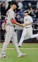  ?? AP PHOTO ?? DOWNER: Rick Porcello hangs his head after giving up a threerun homer to Chris Carter.