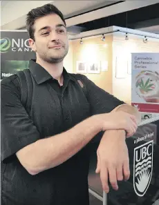  ?? NICK PROCAYLO ?? Marco Cacchione checks out displays at the National Institute for Cannabis Health and Education job fair in Vancouver, Thursday.