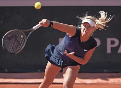  ?? SUSAN MULLANE/USA TODAY SPORTS ?? Peyton Stearns serves against Jelena Ostapenko during their French Open match Wednesday in Paris. Stearns won 6-3, 1-6, 6-2 to reach the third round at a Grand Slam tournament for the first time.