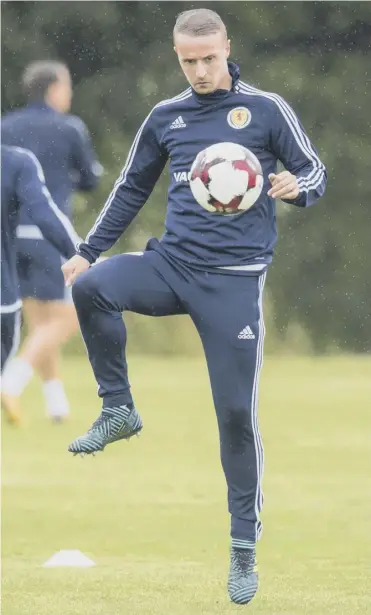  ??  ?? 0 Leigh Griffiths keeps his eye on the ball during Scotland training ahead of their key game tomorrow.