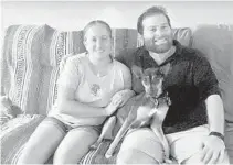  ?? GAYLE
TOLCHIN/COURTESY ?? Melanie Tolchin and Bryan Ludwin, of Boynton Beach, sit with their dog, Sully. They postponed their wedding from Nov. 7 to May 23.