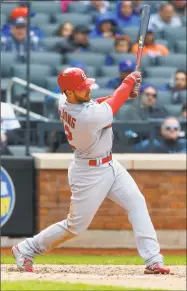  ?? Jim McIsaac / Getty Images ?? Paul DeJong of the Cardinals follows through on an eighth-inning home run against the Mets Sunday at Citi Field in New York.