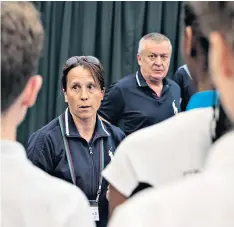  ??  ?? Military bearing: Aspiring ball boys and ball girls take in instructio­ns (main) and listen to Sarah Goldson, (above), who conducts training sessions which include the art of rolling and feeding (left); the Telegraph’sCharlie Eccleshare (below) tries to keep up