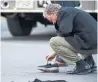  ??  ?? An inspector looks at evidence on Yonge St. last April.