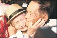  ?? Lee Ji-eun / Associated Press ?? South Korean Lee Keum-seom, 92, left, weeps with her North Korean son Ri Sang Chol, 71, during the Separated Family Reunion Meeting at the Diamond Mountain resort in North Korea on Monday. Dozens of elderly South Koreans crossed the heavily fortified border into North Korea on Monday for heart-wrenching meetings with relatives most have not seen since they were separated by the turmoil of the Korean War.