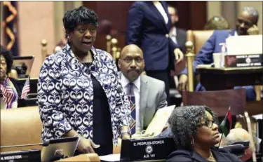  ?? HANS PENNINK - ASSOCIATED PRESS ?? In this March 31 file photo, New York Assembly Majority Leader Crystal D. Peoples-Stokes, D-Buffalo, speaks while debating bills in the Assembly Chamber at the state Capitol in Albany, N.Y. Peoples-Stokes agrees legalizing marijuana isn’t a panacea for minority communitie­s. But the Assembly’s first African-American majority leader is championin­g a recreation­al-pot proposal that’s currently being revised.