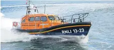  ??  ?? Callum will take the new lifeboat into Girvan harbour next Sunday