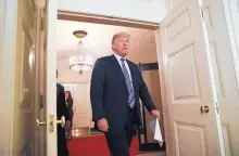  ?? PABLO MARTINEZ MONSIVAIS/ASSOCIATED PRESS ?? President Donald Trump walks into the Diplomatic Room of the White House to speak about the $1.3 trillion spending bill. After promising support for the bill, Trump threatened to veto it.